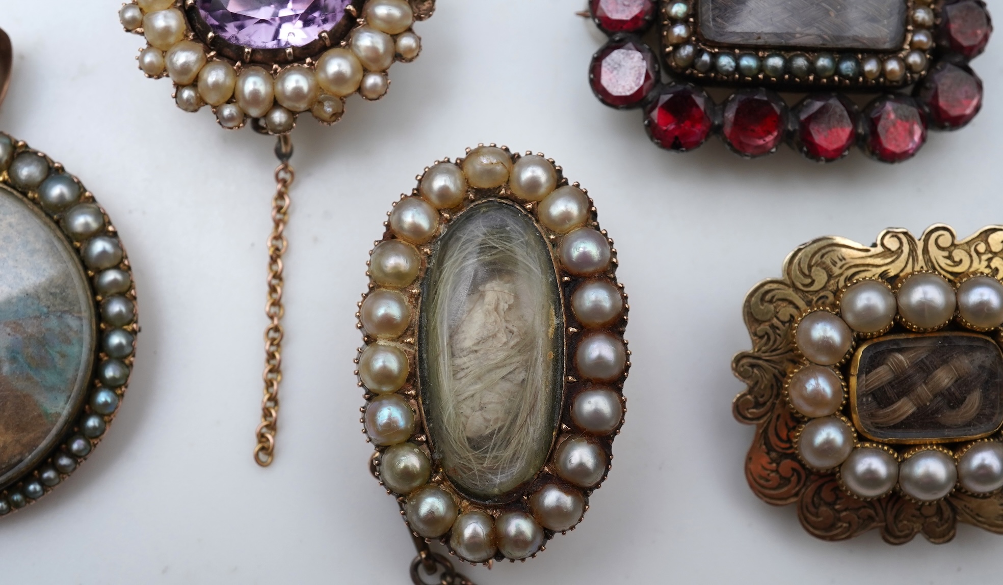 A collection of five Georgian/Victorian brooches, circa 1800-1900